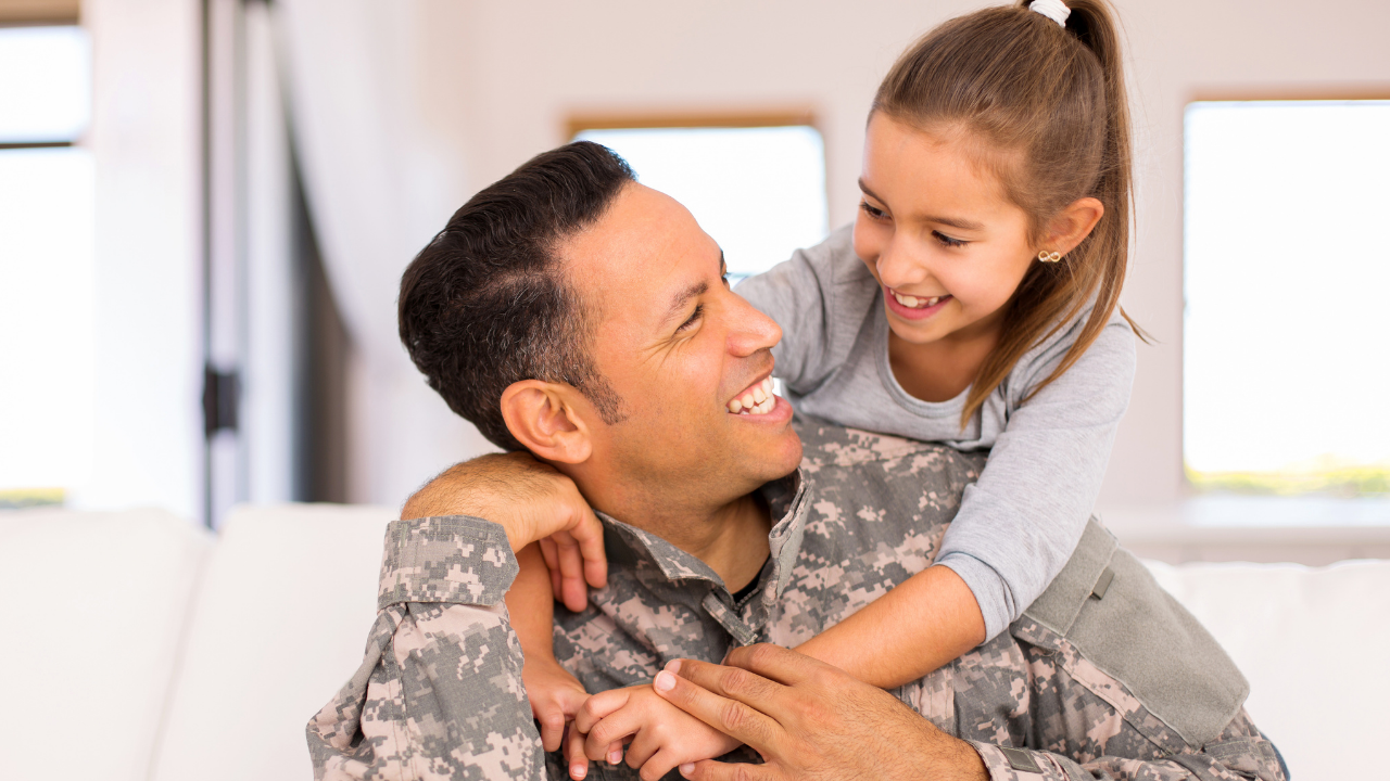 soldier with daughter on back