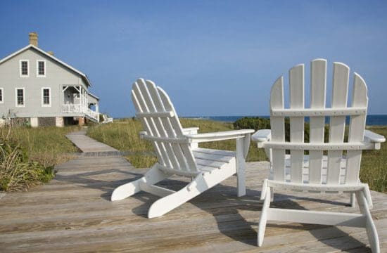 chairs on wooden deck overlooking the ocean