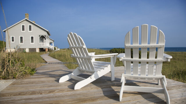 chairs on wooden deck overlooking the ocean