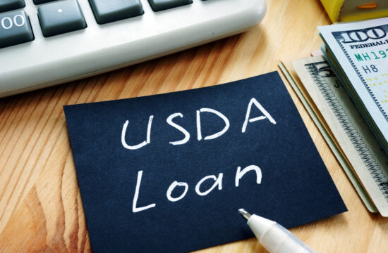 Piece of paper sitting on table. USDA Loan written on paper.