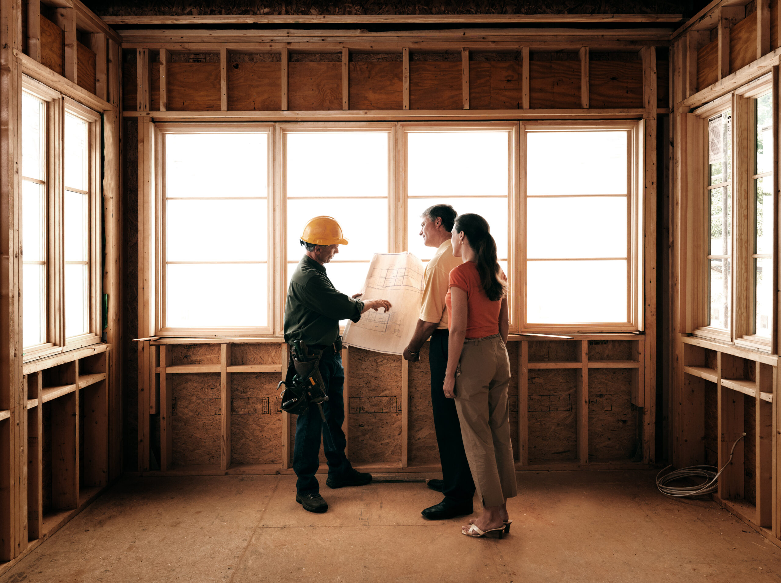 Couple meeting with architect about home addition.